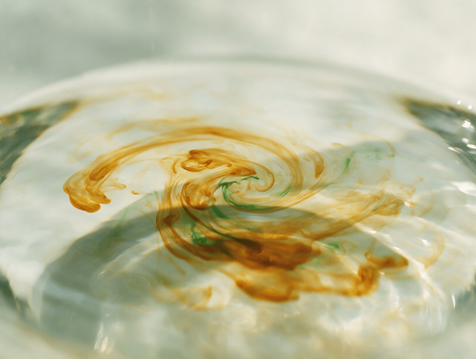 Amber swirls in clear water