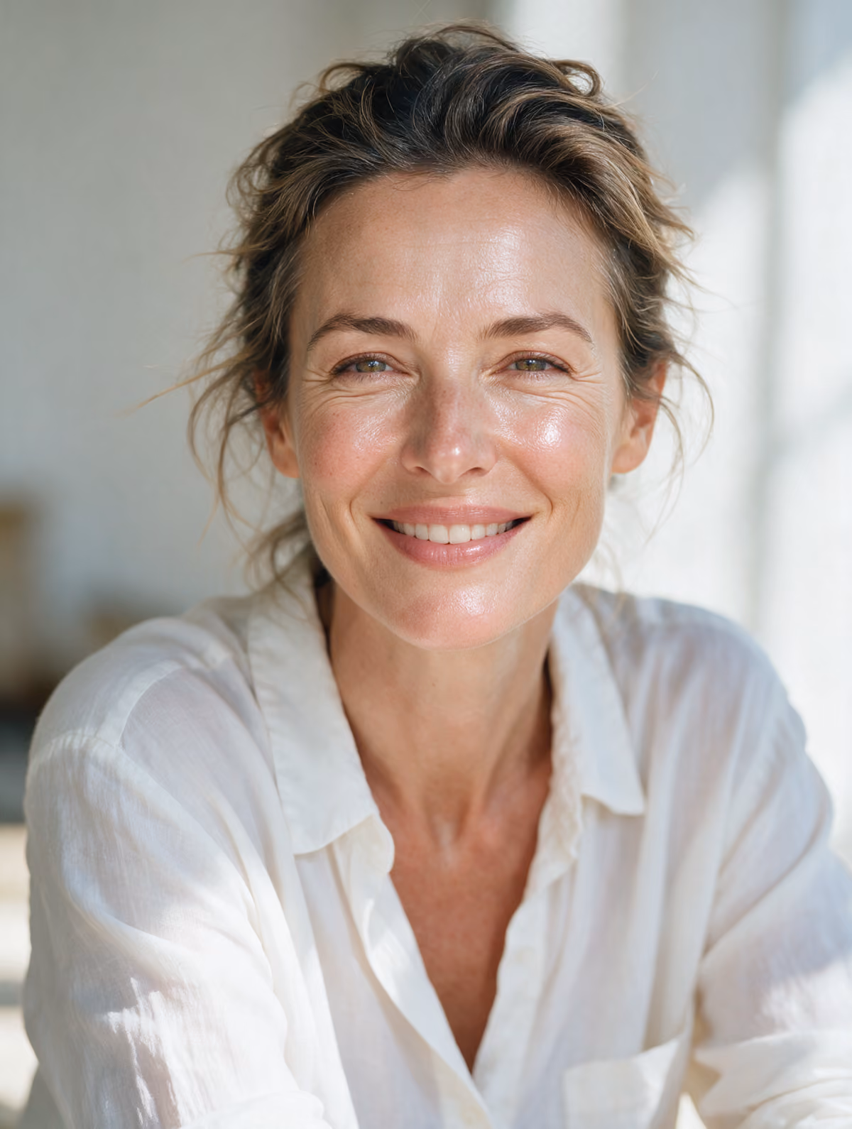 Woman with radiant skin and a relaxed smile